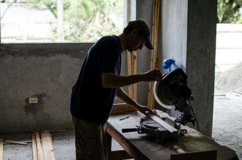 Tom working at a saw