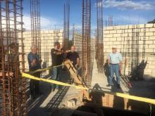 The team tours the work site