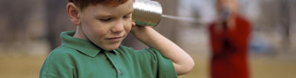 boys talking with tin cans on a string